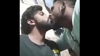 girls kiss while facesitting a guy